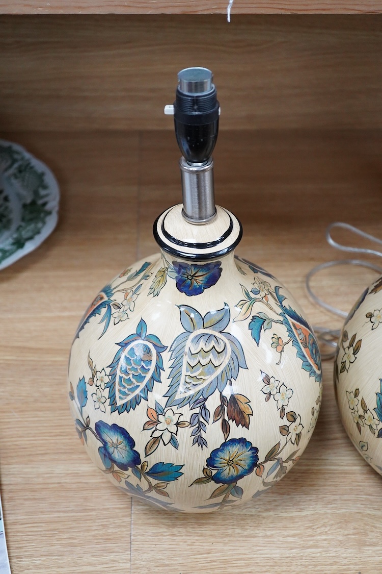 A pair of Persian inspired floral painted pottery table lamps, 33cm high